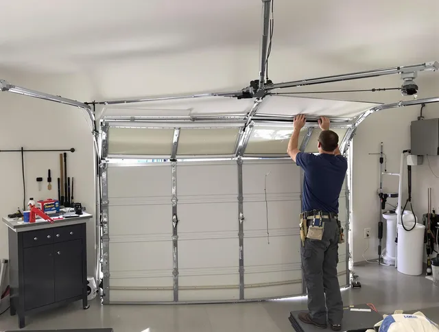Cleveland Garage Door Repair specialist performing precise section replacement on Cleveland garage door